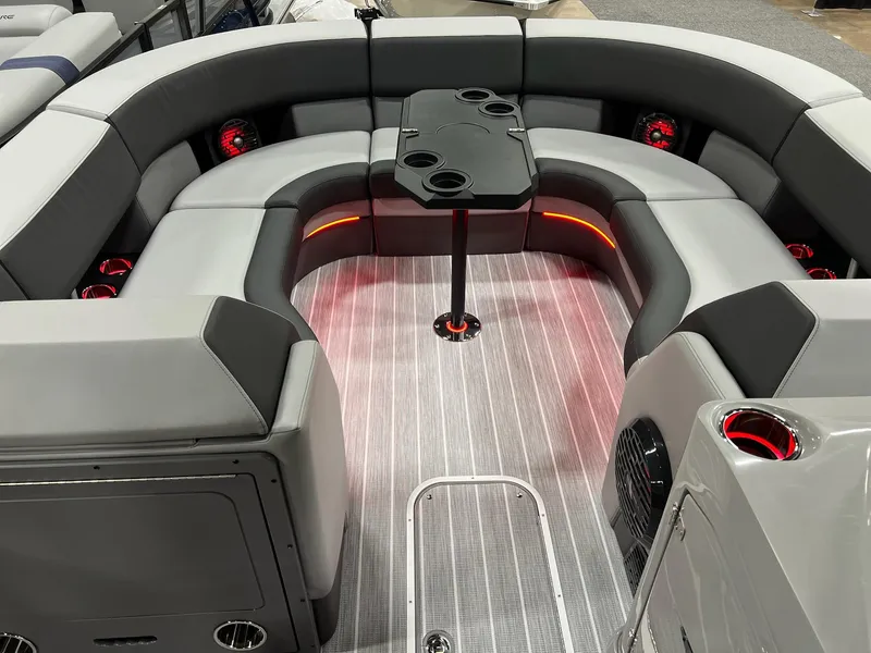 Slide: The Image of Luxurious seating area on 2025 Berkshire 25RFX Roswell Arch STS Tritoon with ambient lighting. - 20