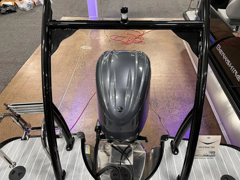 Slide: The Image of 2025 Berkshire 25RFX Roswell Arch STS Tritoon with sleek engine and modern design. - 24