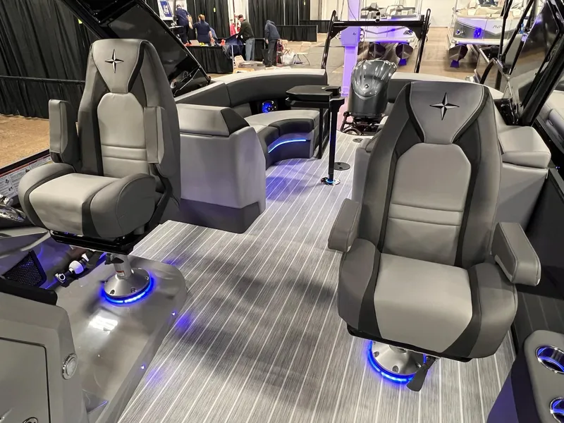 Slide: The Image of Luxurious interior of 2025 Berkshire 25RFX Roswell Arch STS Tritoon with modern seating. - 25