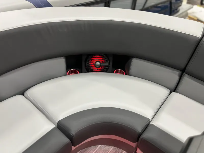 Slide: The Image of Luxurious seating on 2025 Berkshire 25RFX Roswell Arch STS Tritoon with modern design and red lighting. - 26