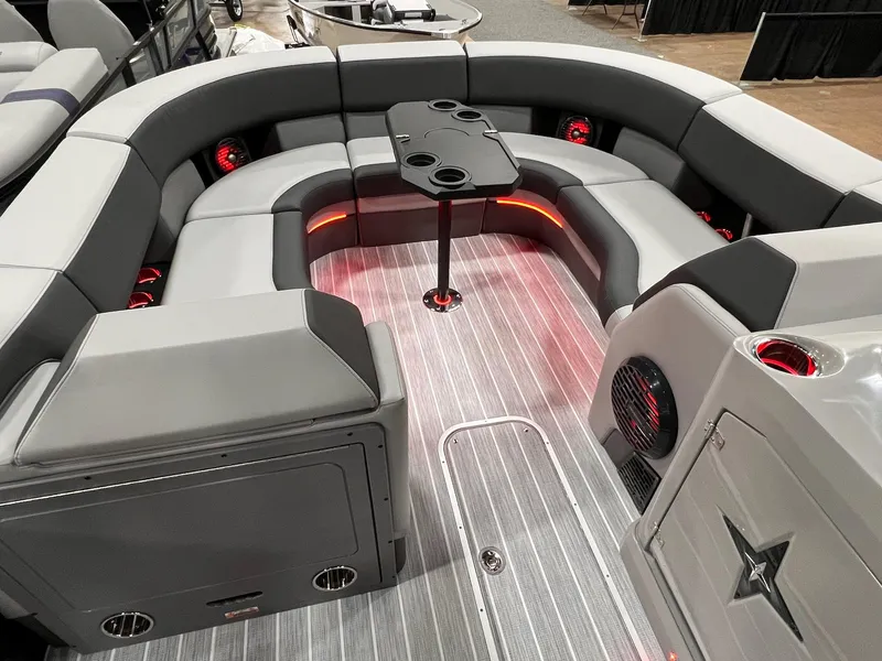 Slide: The Image of Luxurious seating area of 2025 Berkshire 25RFX Roswell Arch STS Tritoon with ambient lighting. - 27