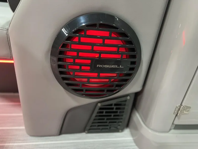 Slide: The Image of Roswell speaker with red lighting in 2025 Berkshire 25RFX Roswell Arch STS Tritoon. - 29