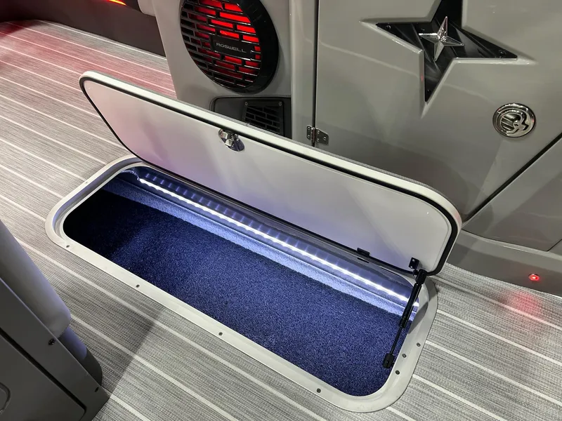 Slide: The Image of 2025 Berkshire 25RFX Roswell Arch STS Tritoon storage compartment with LED lighting. - 32