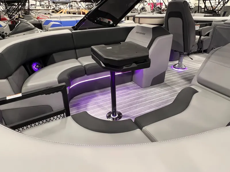 Slide: The Image of 2025 Berkshire 25RFX Roswell Arch STS Tritoon interior with modern seating and ambient lighting. - 33
