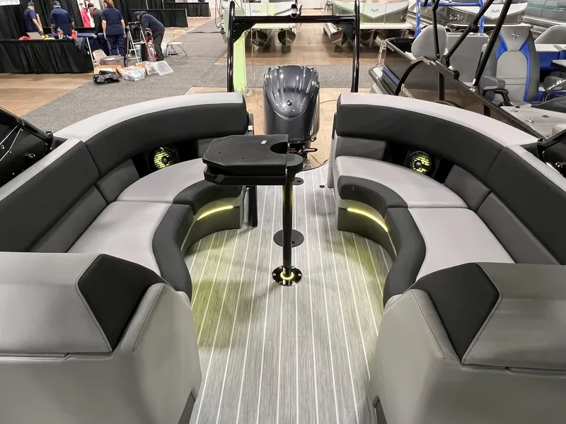 Slide: The Image of Interior of 2025 Berkshire 25RFX Roswell Arch STS Tritoon with modern seating and table. - 35