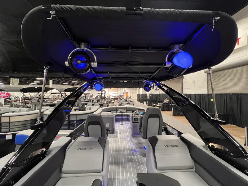 Slide: The Image of 2025 Berkshire 25RFX Roswell Arch STS Tritoon with illuminated interior and sleek design. - 36