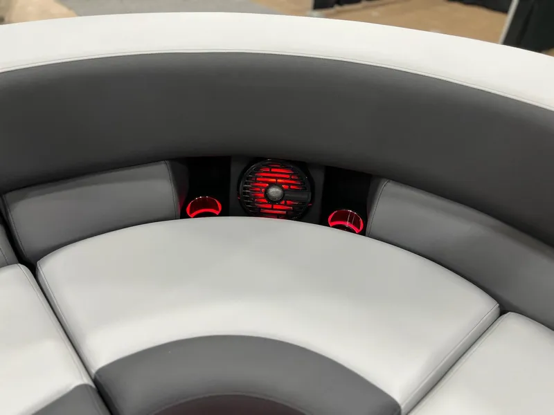 Slide: The Image of Interior seating of 2025 Berkshire 25RFX Roswell Arch STS Tritoon with red-lit cup holders. - 37