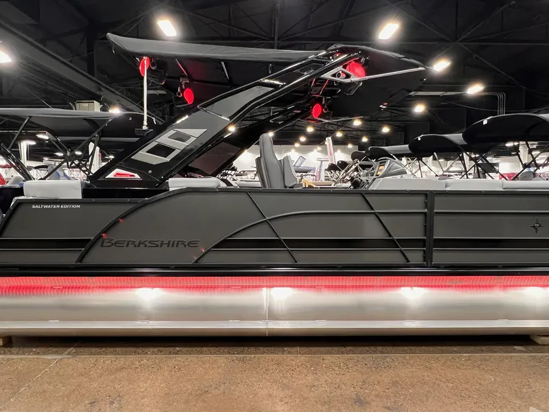 Slide: The Image of 2025 Berkshire 25RFX Roswell Arch STS Tritoon, sleek design, showcased indoors with modern lighting. - 40