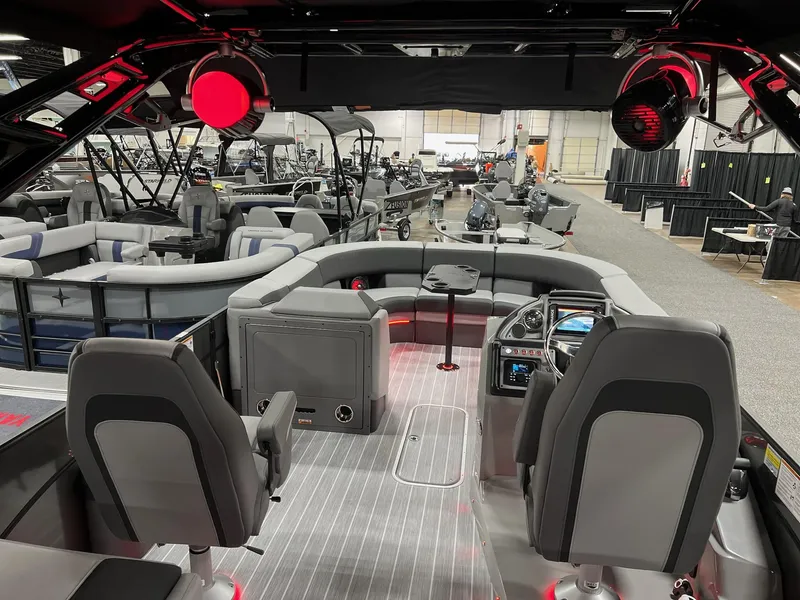 Slide: The Image of 2025 Berkshire 25RFX Roswell Arch STS Tritoon interior with modern seating and control panel. - 43