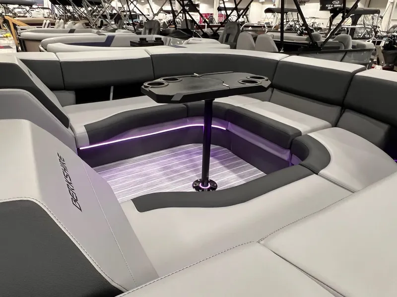 Slide: The Image of 2025 Berkshire 25RFX Roswell Arch STS Tritoon interior with sleek seating and ambient lighting. - 46
