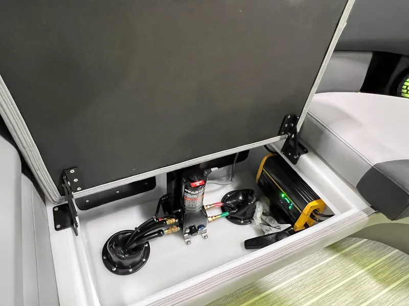 Slide: The Image of Storage compartment of 2025 Berkshire 25RFX Roswell Arch STS Tritoon, showcasing electrical components. - 6