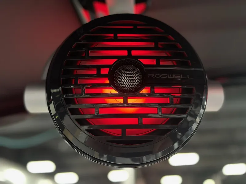 Slide: The Image of Close-up of Roswell speaker with red light on 2025 Berkshire 25RFX Roswell Arch STS Tritoon. - 8