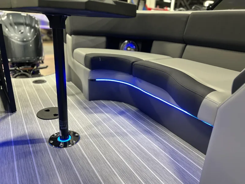 Slide: The Image of 2025 Berkshire 25RFX Roswell Arch STS Tritoon interior with LED lighting and sleek seating. - 9