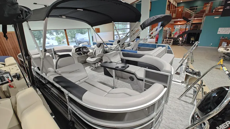 Slide: The Image of 2024 South Bay 224RS LE 2.75 pontoon boat interior in showroom. - 3
