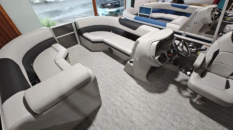 Slide: The Image of 2024 South Bay 224RS LE 2.75 pontoon boat interior with plush seating and modern helm. - 9