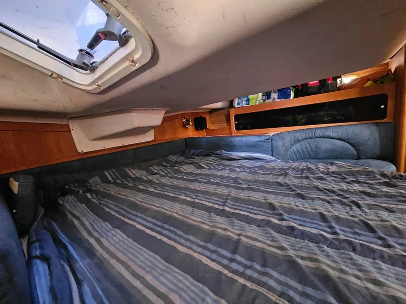 Slide: The Image of Interior of a 2000 Catalina 380 yacht with cozy sleeping area. - 13