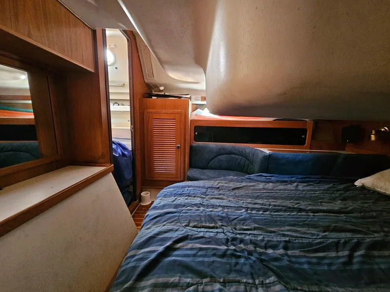 Slide: The Image of Interior of a 2000 Catalina 380 yacht with cozy bed. - 17