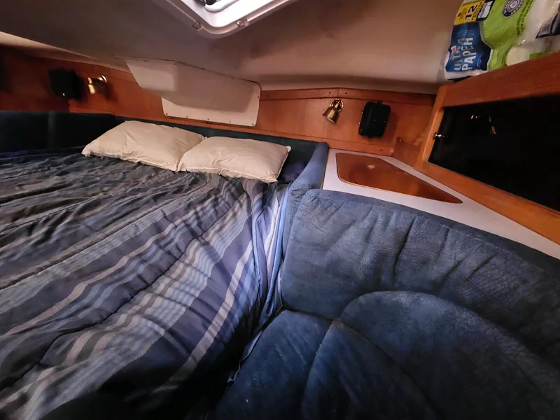 Slide: The Image of Interior of a 2000 Catalina 380 yacht with a cozy bed. - 18