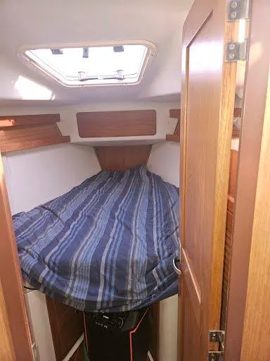 Slide: The Image of Interior of a 2000 Catalina 380 yacht with cozy sleeping cabin. - 19