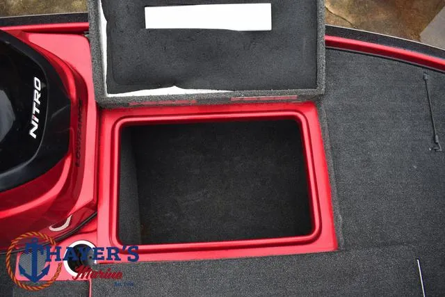 Slide: The Image of 2014 Nitro Z Series Z-6 boat storage compartment with open lid. - 12