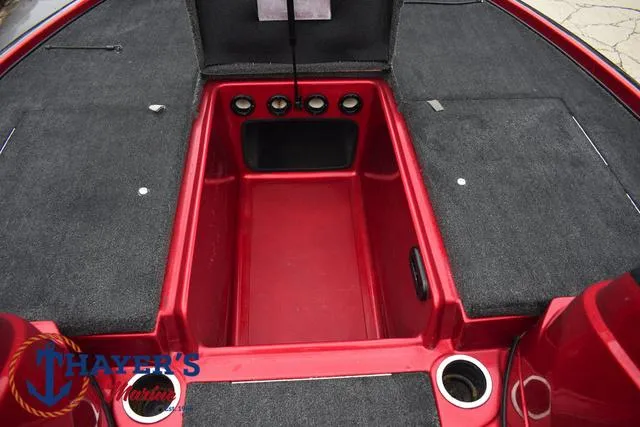 Slide: The Image of 2014 Nitro Z Series Z-6 boat interior with storage compartment and cup holders. - 14