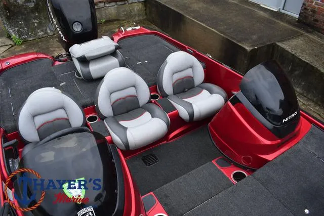 Slide: The Image of 2014 Nitro Z Series Z-6 boat interior with gray and red seating. - 18