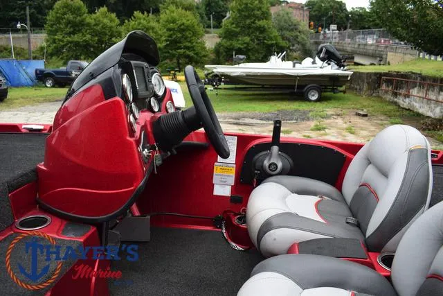 Slide: The Image of 2014 Nitro Z Series Z-6 boat interior with steering wheel and seats. - 24
