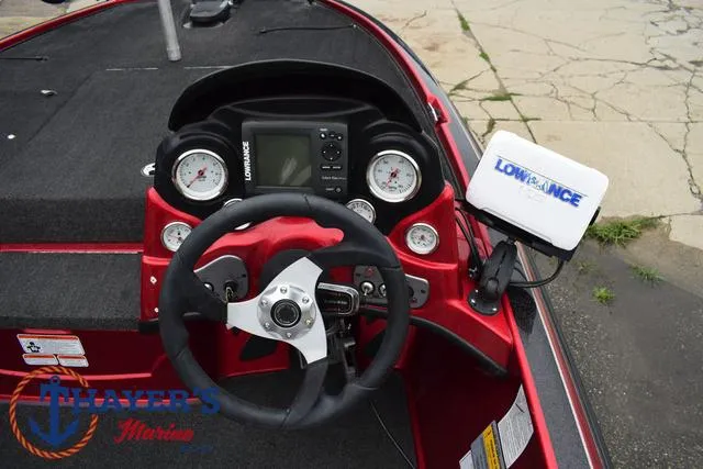 Slide: The Image of 2014 Nitro Z Series Z-6 boat dashboard with Lowrance electronics and steering wheel. - 25