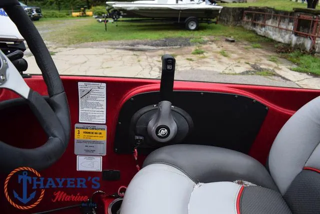 Slide: The Image of Interior of 2014 Nitro Z Series Z-6 boat with steering and throttle controls. - 29
