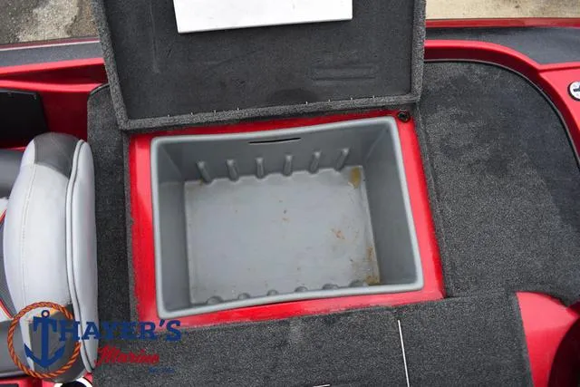 Slide: The Image of 2014 Nitro Z Series Z-6 boat storage compartment, open lid, gray interior, red exterior. - 32