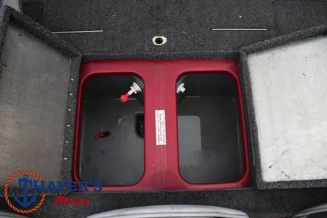 Slide: The Image of 2014 Nitro Z Series Z-6 boat storage compartments with carpeted interior. - 34