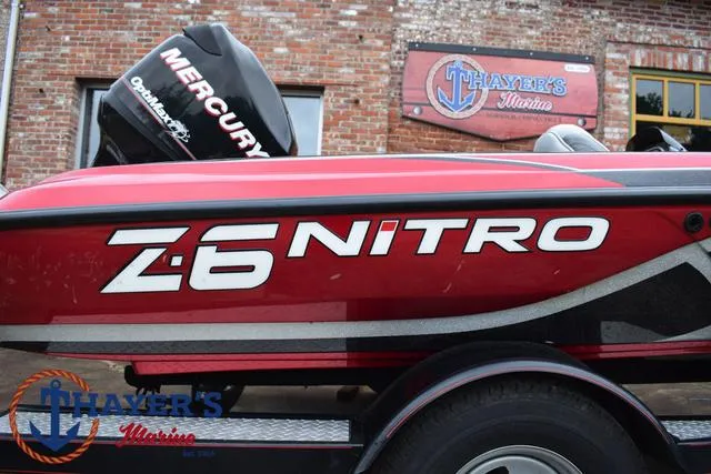 Slide: The Image of Red 2014 Nitro Z Series Z-6 boat with Mercury engine at Thayer's Marine. - 4