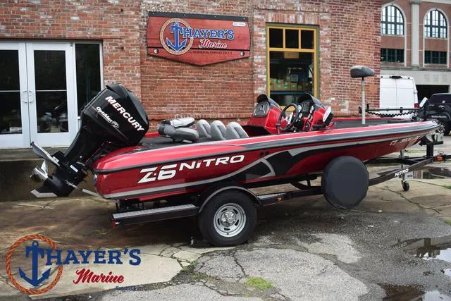 Slide: The Image of 2014 Nitro Z Series Z-6 boat at Thayer's Marine, red and black design. - 41