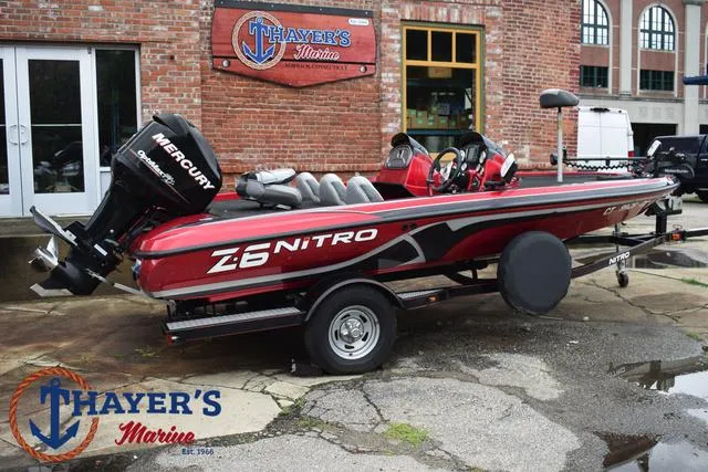 Slide: The Image of 2014 Nitro Z Series Z-6 boat at Thayer's Marine, featuring a Mercury engine. - 42