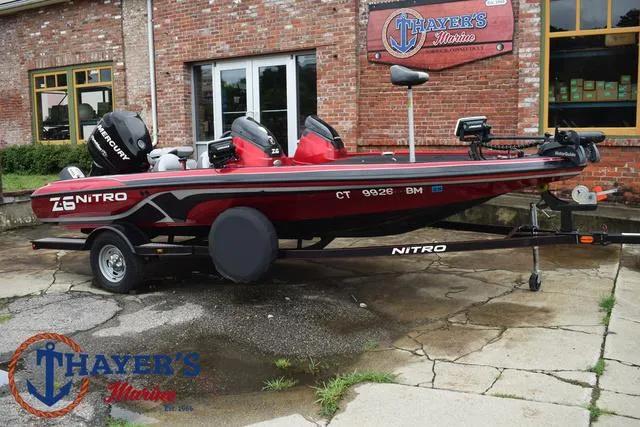 Slide: The Image of 2014 Nitro Z Series Z-6 boat in front of Thayer's Marine brick building. - 44