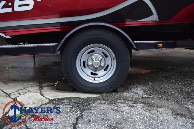 Slide: The Image of 2014 Nitro Z Series Z-6 boat trailer wheel on concrete, Thayer's Marine logo visible. - 5