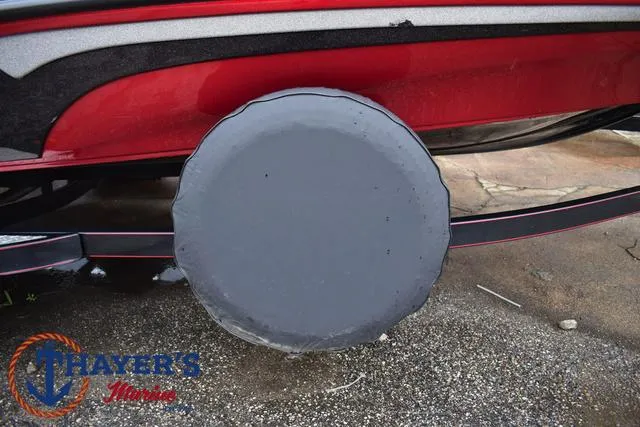 Slide: The Image of 2014 Nitro Z Series Z-6 boat trailer with covered wheel, red and black design. - 6