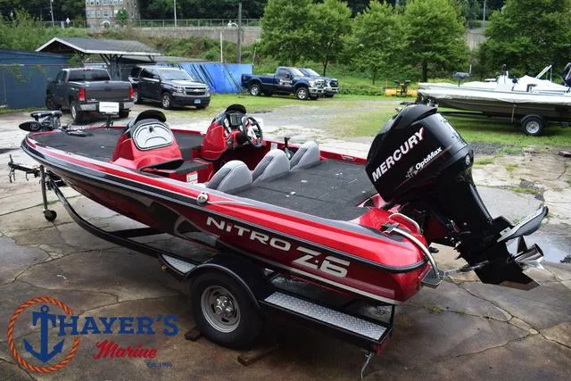 Slide: The Image of 2014 Nitro Z Series Z-6 boat with Mercury outboard motor on trailer at Thayer's Marine. - 8