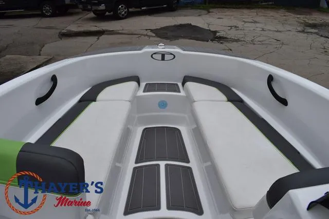 Slide: The Image of 2022 Tahoe T16 boat interior with seating and Thayer's Marine logo. - 11