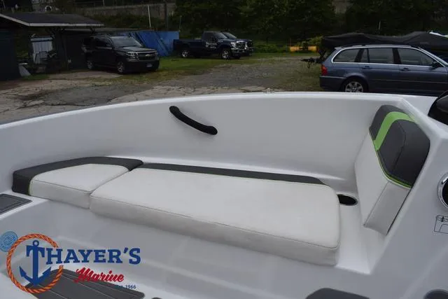 Slide: The Image of 2022 Tahoe T16 boat interior with white seating, Thayer's Marine logo visible. - 12