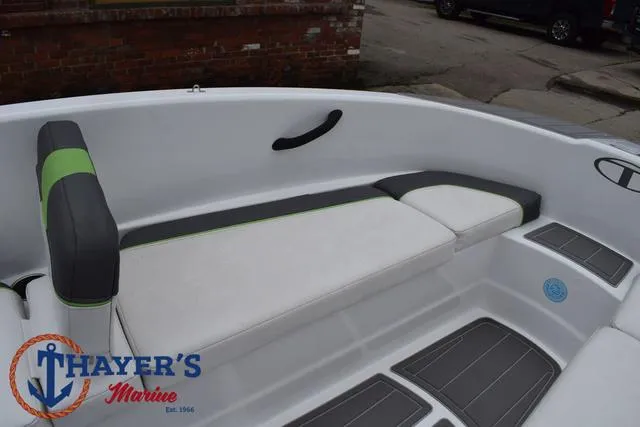 Slide: The Image of 2022 Tahoe T16 boat interior with white and gray seating, Thayer's Marine logo visible. - 13