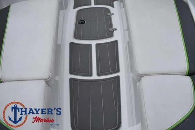Slide: The Image of Tahoe T16 2022 boat interior with gray flooring and white seating, Thayer's Marine logo visible. - 16