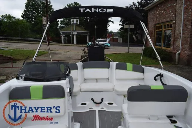 Slide: The Image of 2022 Tahoe T16 boat interior with seating, canopy, and Thayer's Marine logo. - 19