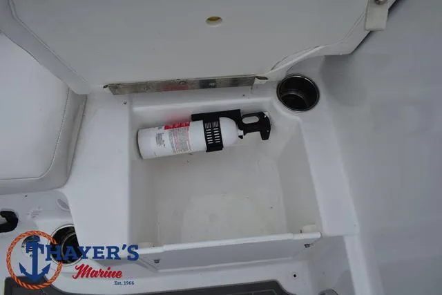 Slide: The Image of Storage compartment in 2022 Tahoe T16 boat with fire extinguisher. - 21