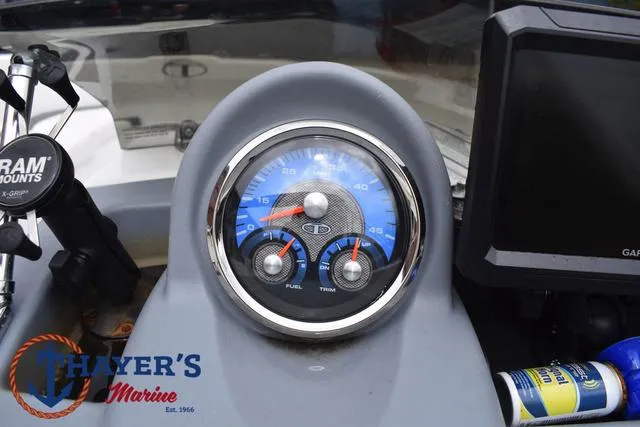 Slide: The Image of Dashboard of a 2022 Tahoe T16 boat with gauges and controls. - 24