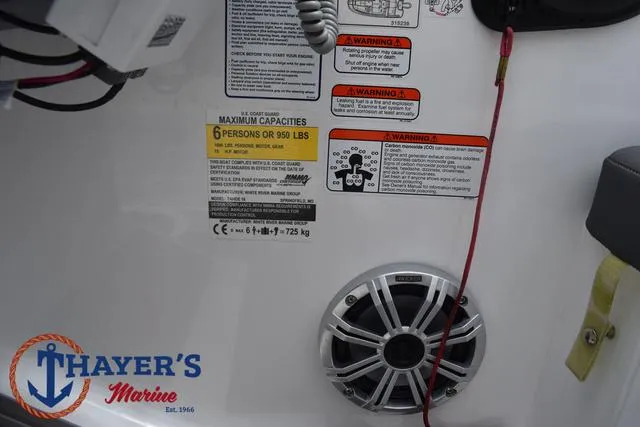 Slide: The Image of Tahoe T16 boat interior with capacity warning labels and speaker, 2022 model. - 26