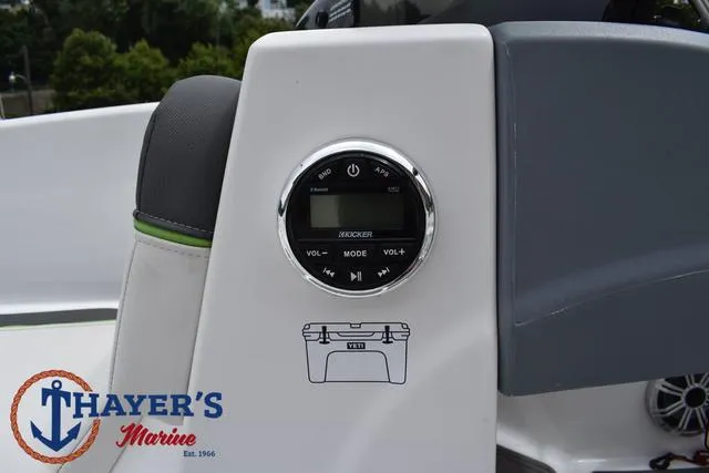 Slide: The Image of Tahoe T16 2022 boat dashboard with Kicker audio system, Thayer's Marine logo visible. - 27