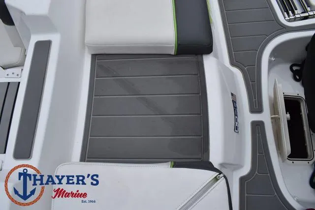 Slide: The Image of Tahoe T16 2022 boat interior with Thayer's Marine logo, featuring gray and white seating. - 32