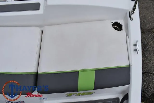 Slide: The Image of Tahoe T16 2022 boat seat with green accent and Thayer's Marine logo. - 33