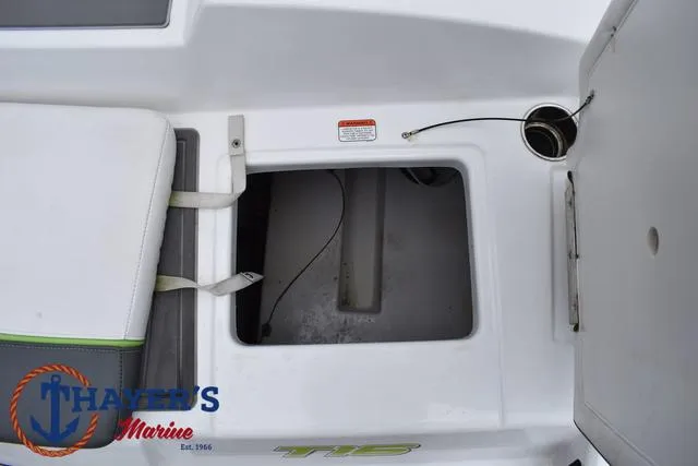 Slide: The Image of 2022 Tahoe T16 boat interior with storage compartment and seating. - 34
